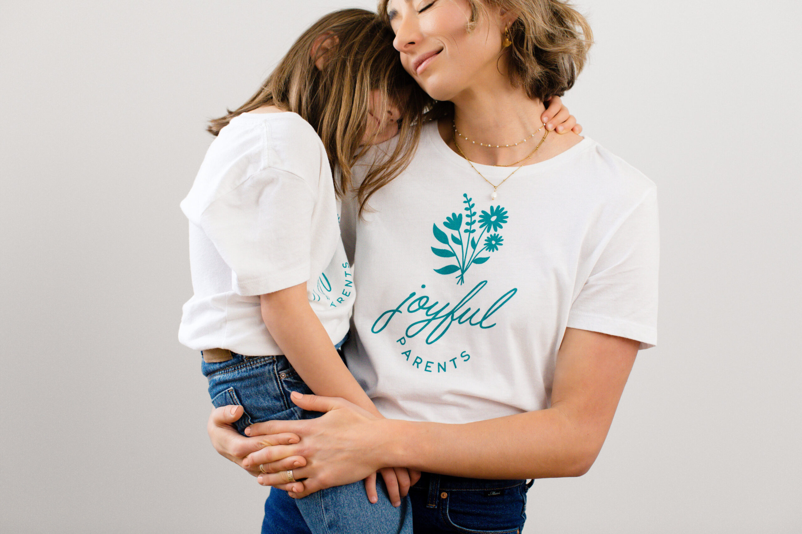 mother holds her toddler