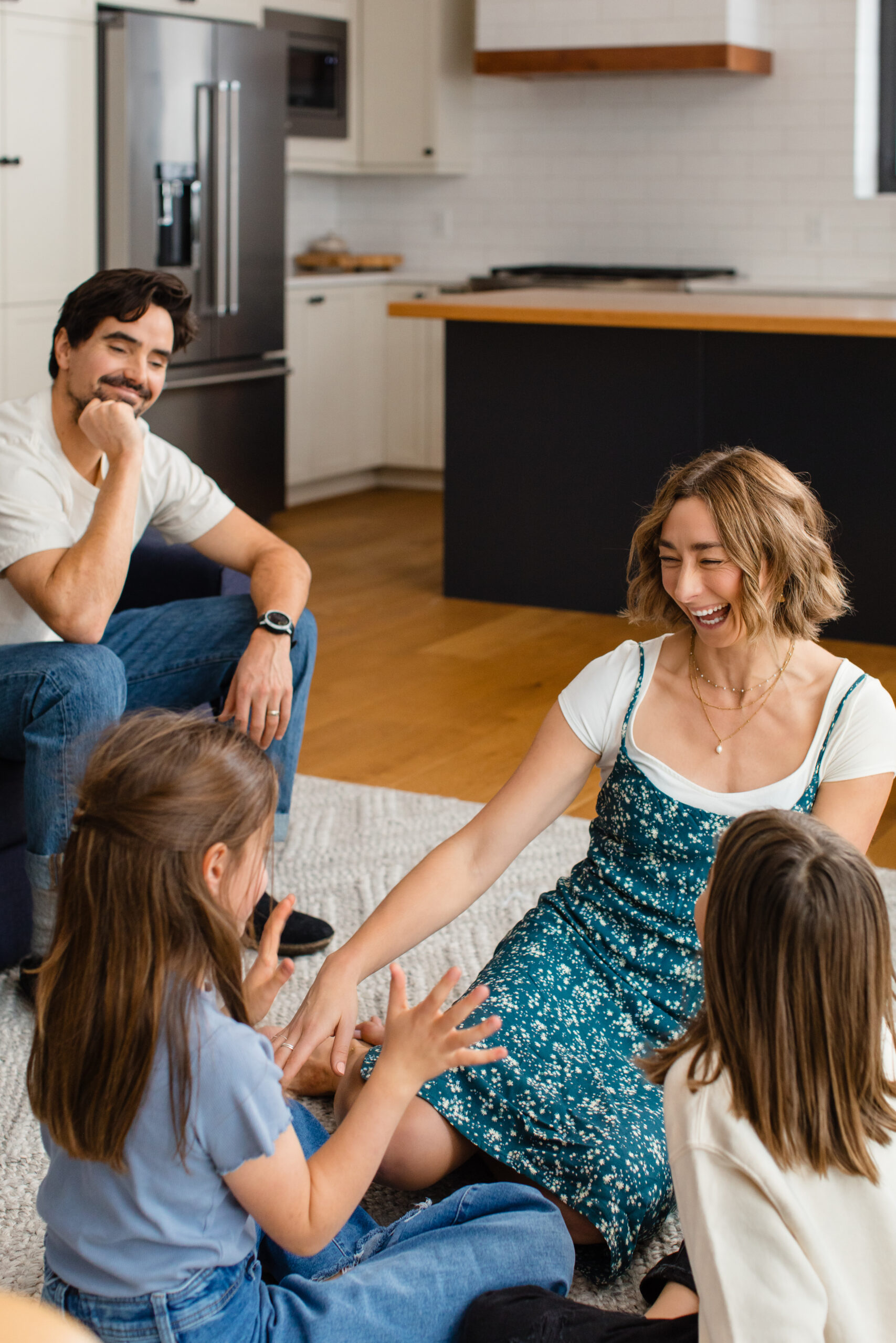 Parents sit with their daughters