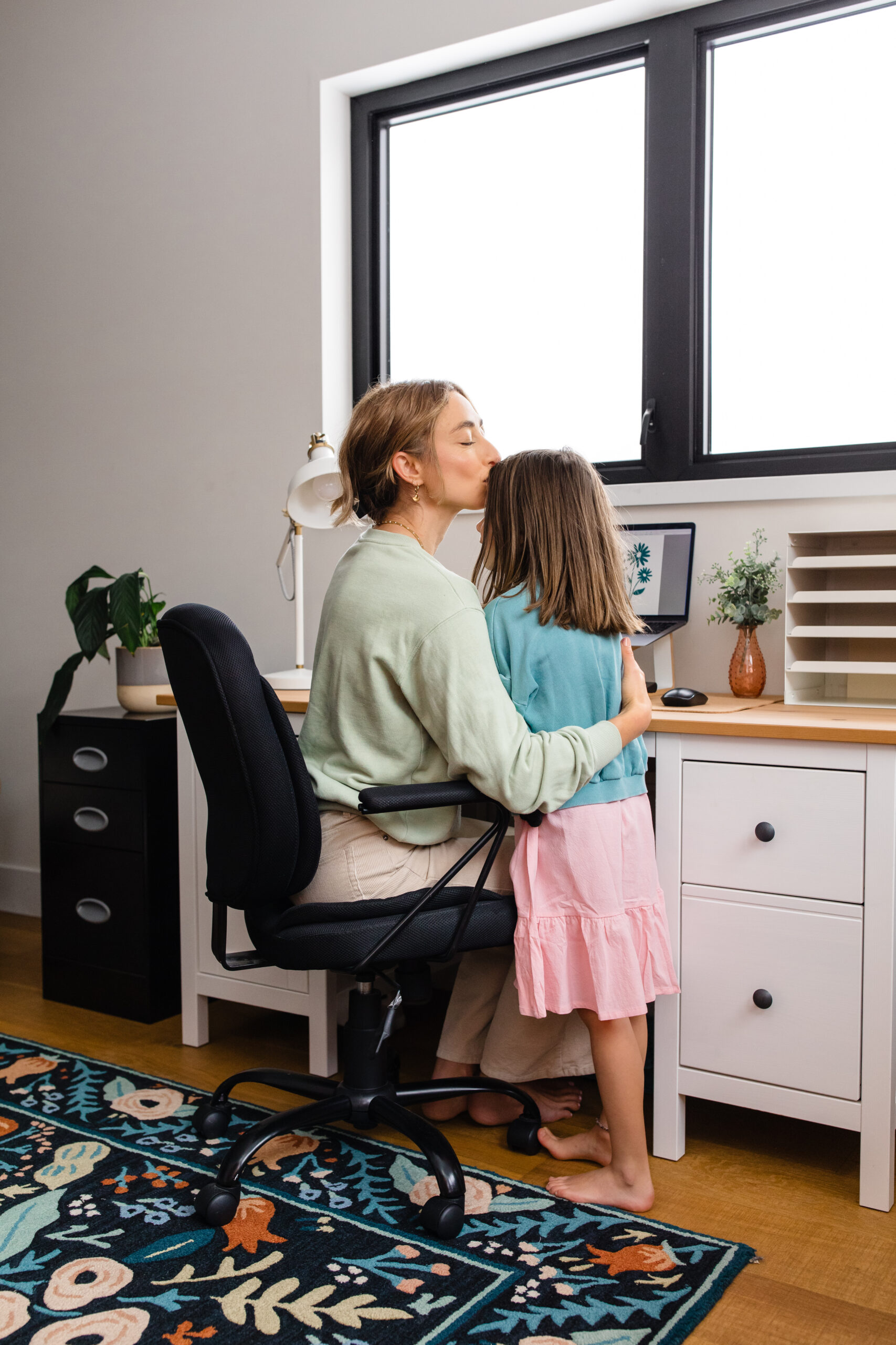 Mother comforts child through transition