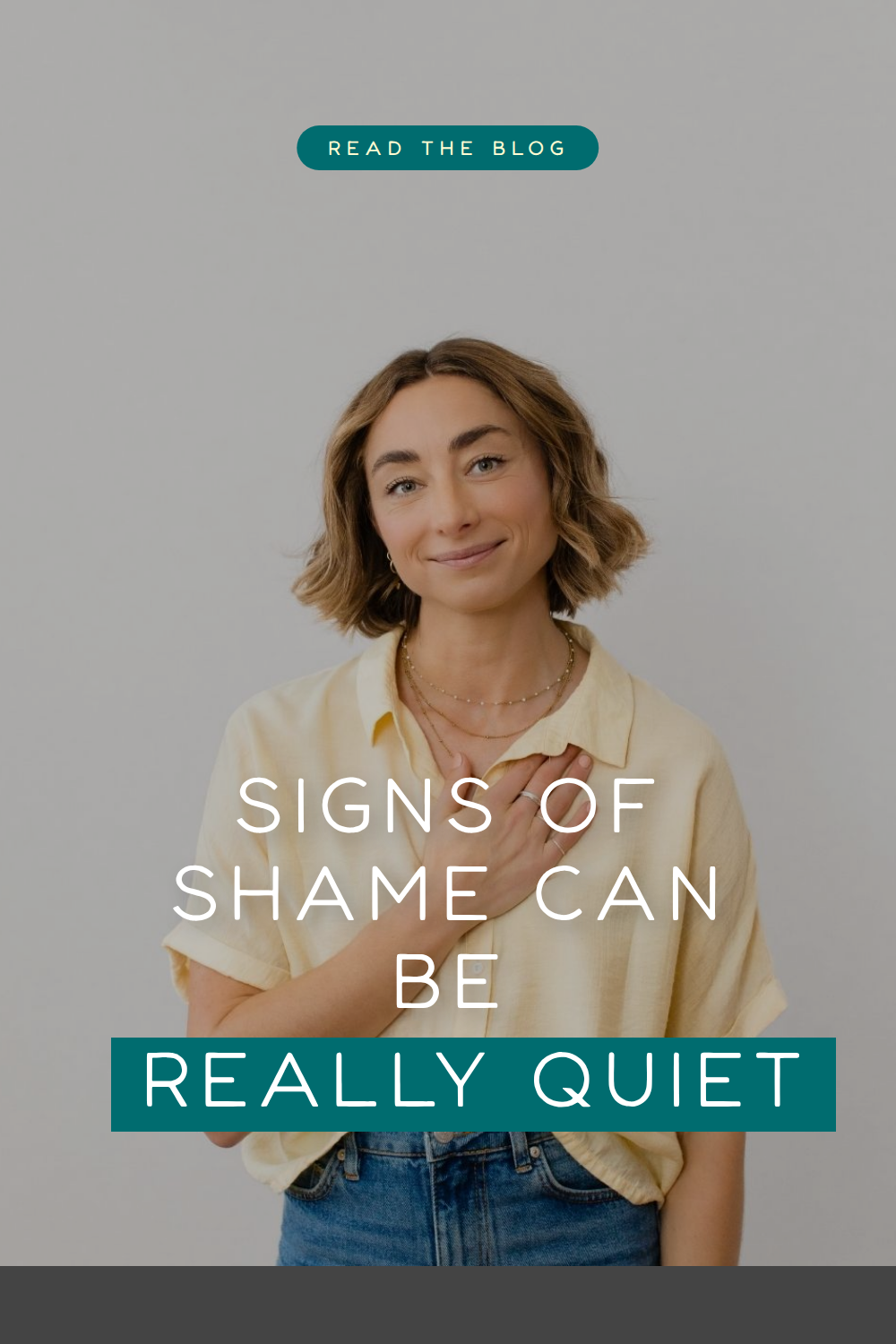 Myla Leinweber, parent coach, standing against a white wall with her hand on her heart