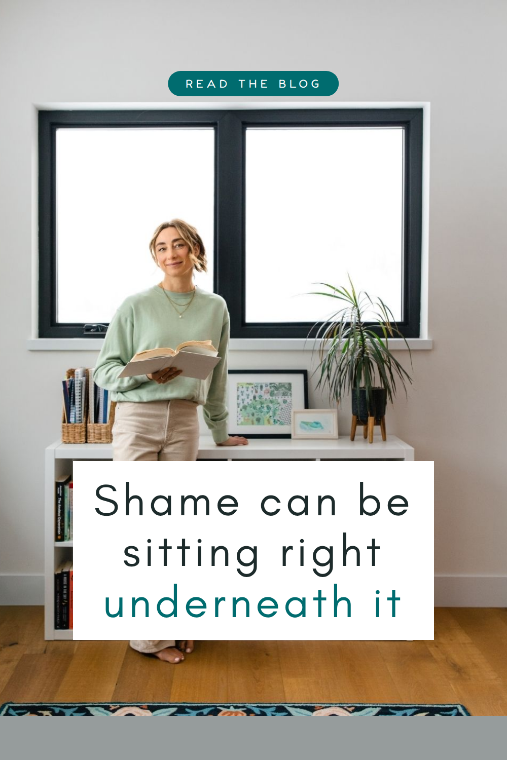 Myla Leinweber standing in front of a bookshelf, reading a book